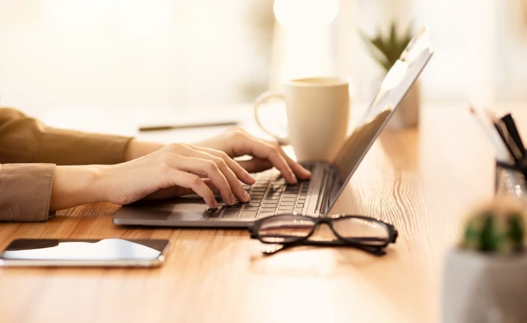 Person typing on a laptop